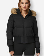 Gesteppte Winterjacke für Damen mit flauschig besetzter Kapuze und breitem Rippbund am Saum